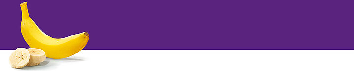 A banana and a sliced banana are presented against a purple background.