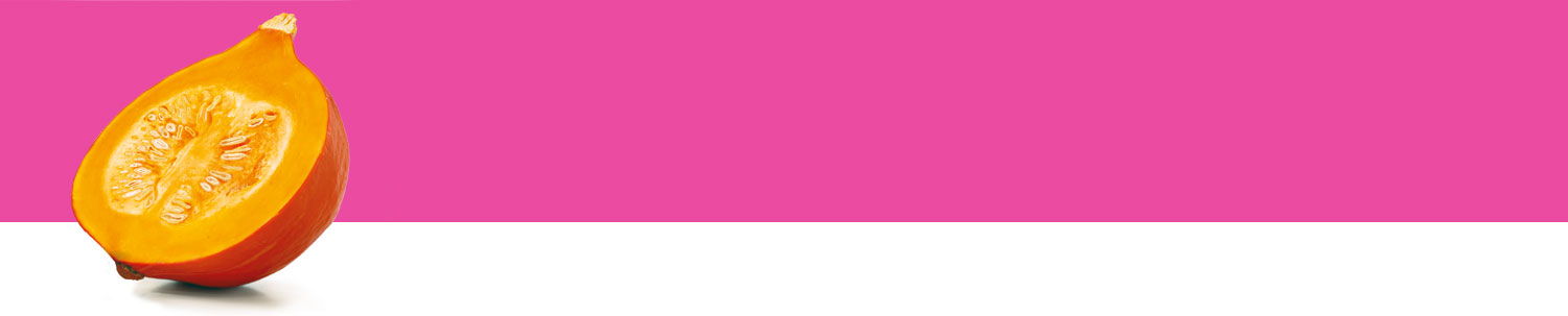 A halved pumpkin with seeds is presented against a pink background.