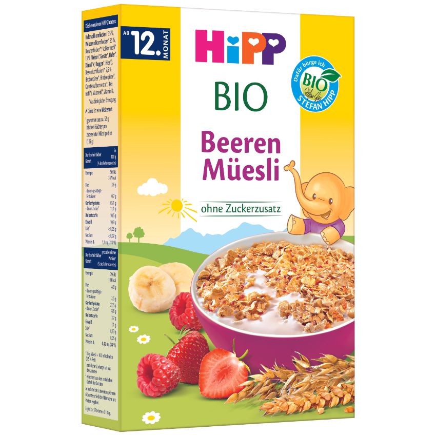 Krabica organického müsli s kresleným slonom, miska müsli a zoznam ingrediencií na boku.